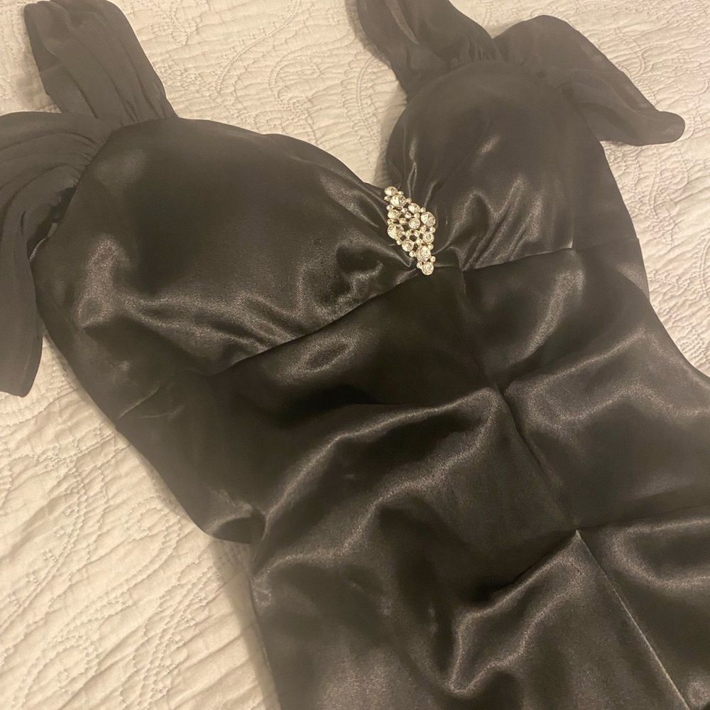 Black mermaid style dress for wedding guest or fancy night out.